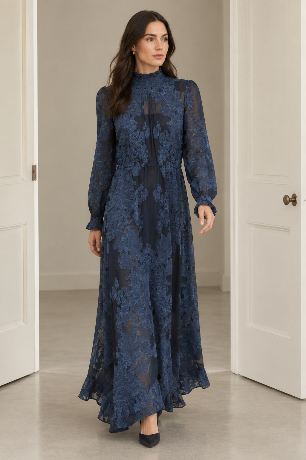 Brunette model wearing the dress and walking through plain doors